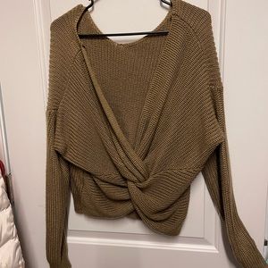 Taupe colored sweater with twist back